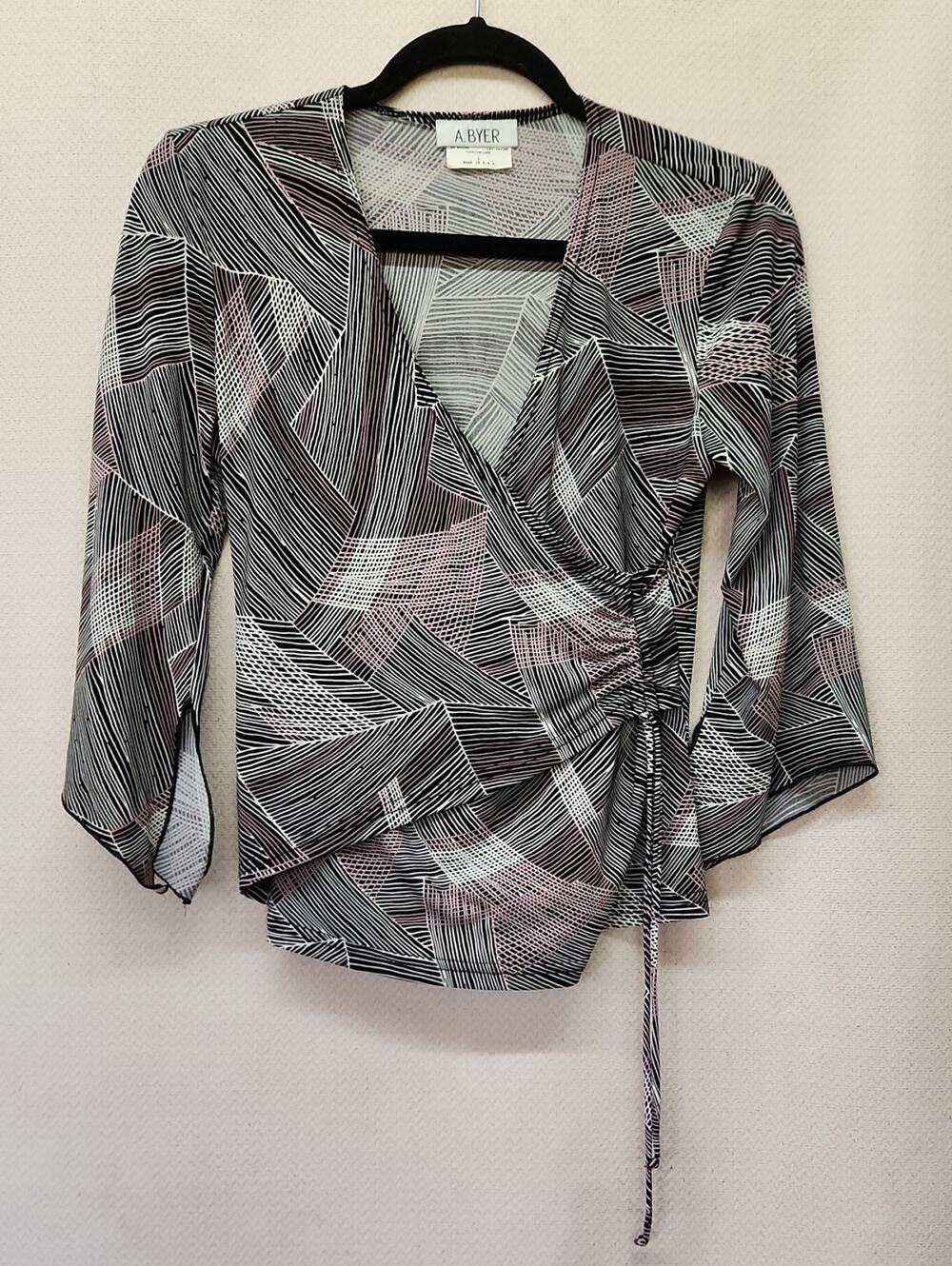 A. Byer Black, White & Pink Geometric Wrap Blouse